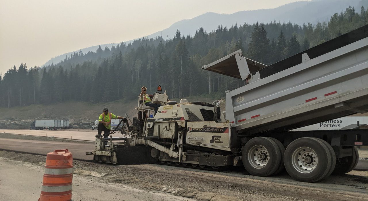 Highway workers with dumptruck