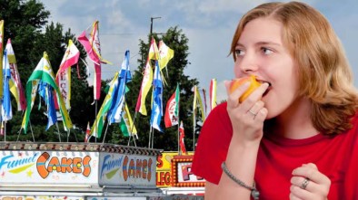 Woman eating candy apple