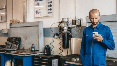 employee scrolling on phone at work